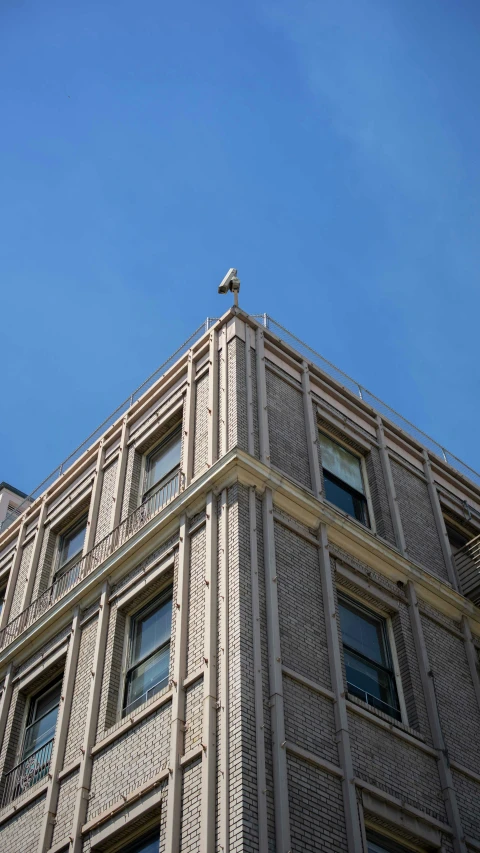 a building with a bird sitting on the top