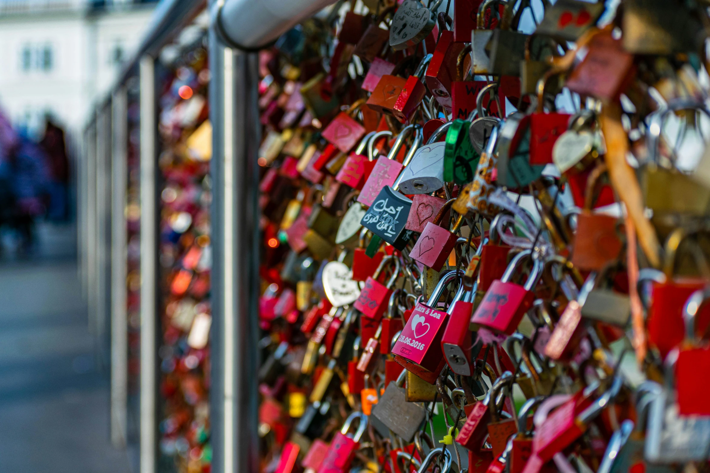 a wall with lots of padlocks on it