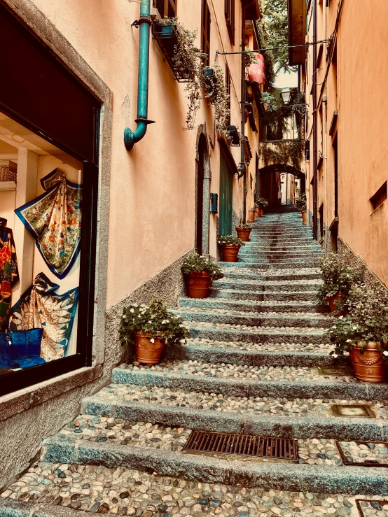 a set of stairs leading up to an alley way