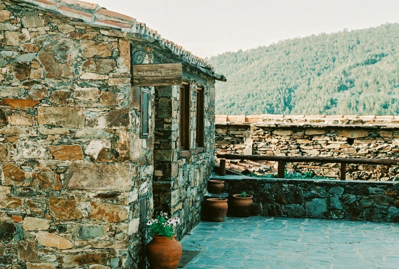 view over terrace of stone and stone building