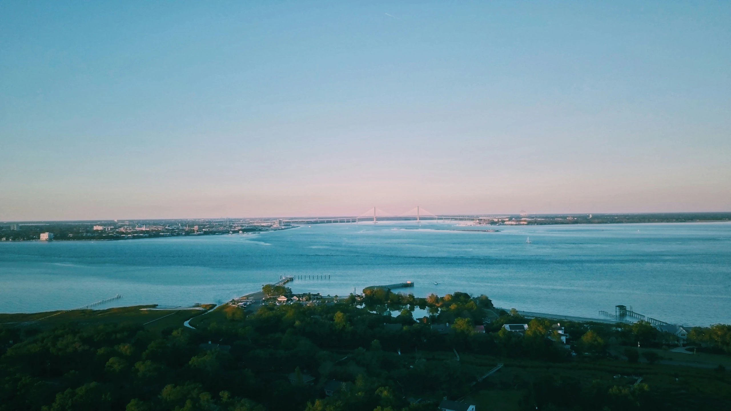 view from the top of a hill looking across a bay