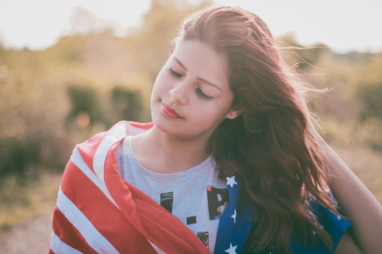 a  with an american flag shirt on