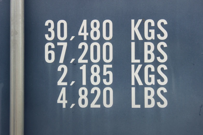 the white markings in front of a gray background include letters that say, 30, 480 kgg and 472, 000lbs