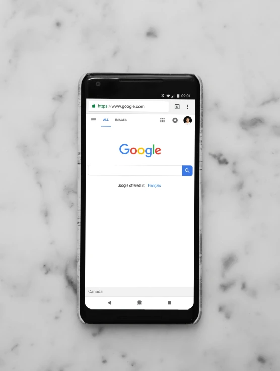 a phone displaying the google search on a marble countertop