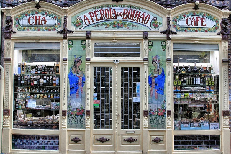 an old fashioned storefront with lots of glass windows