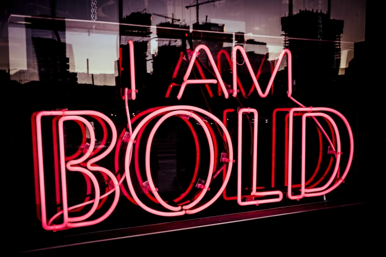 a neon sign that reads, i am bold