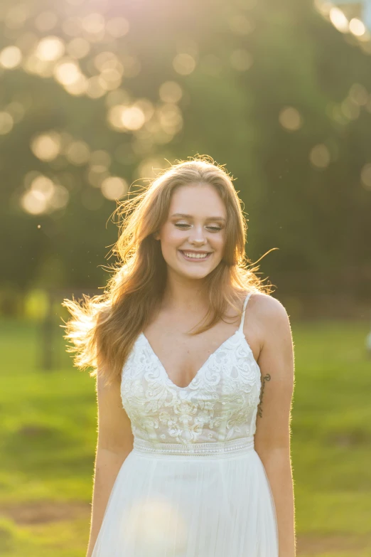 a girl in her wedding dress with long hair