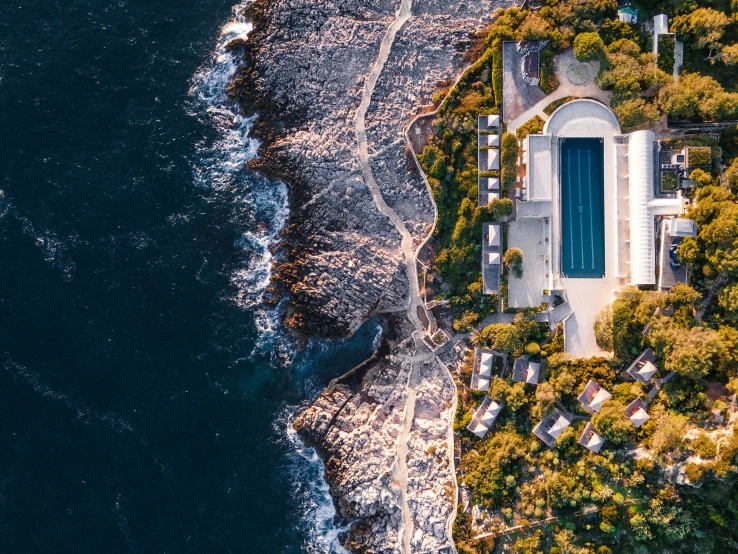 an aerial view shows the pool and beach