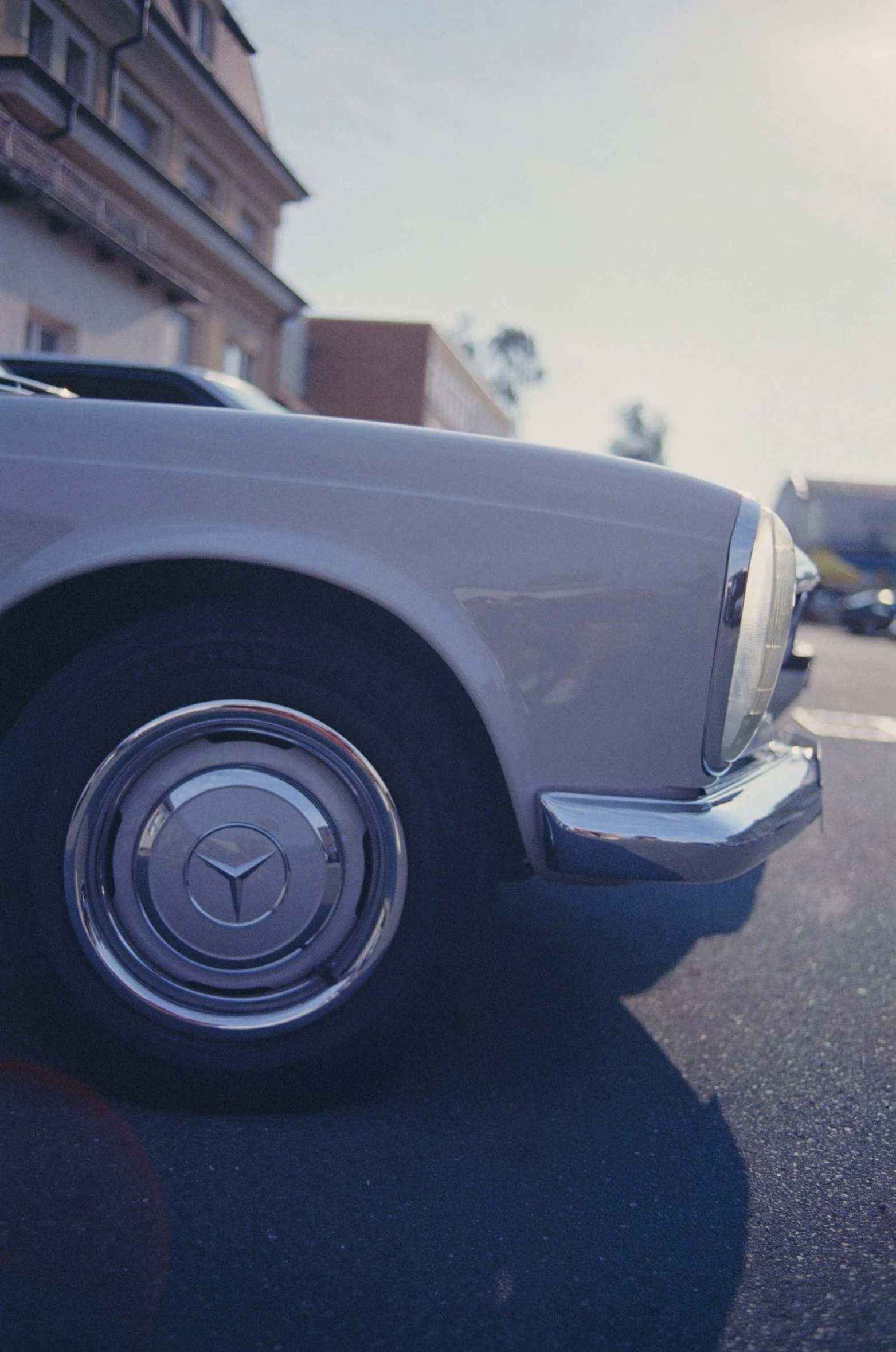 a old time car is parked in the street