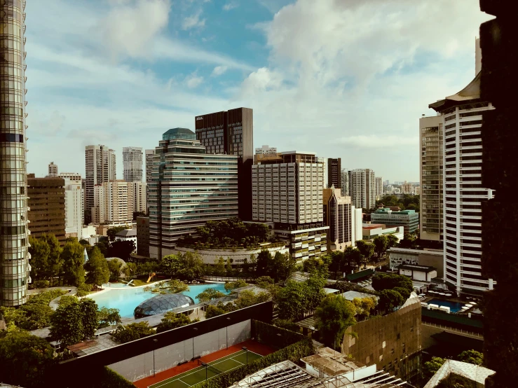 an urban area with a pool surrounded by high rise buildings