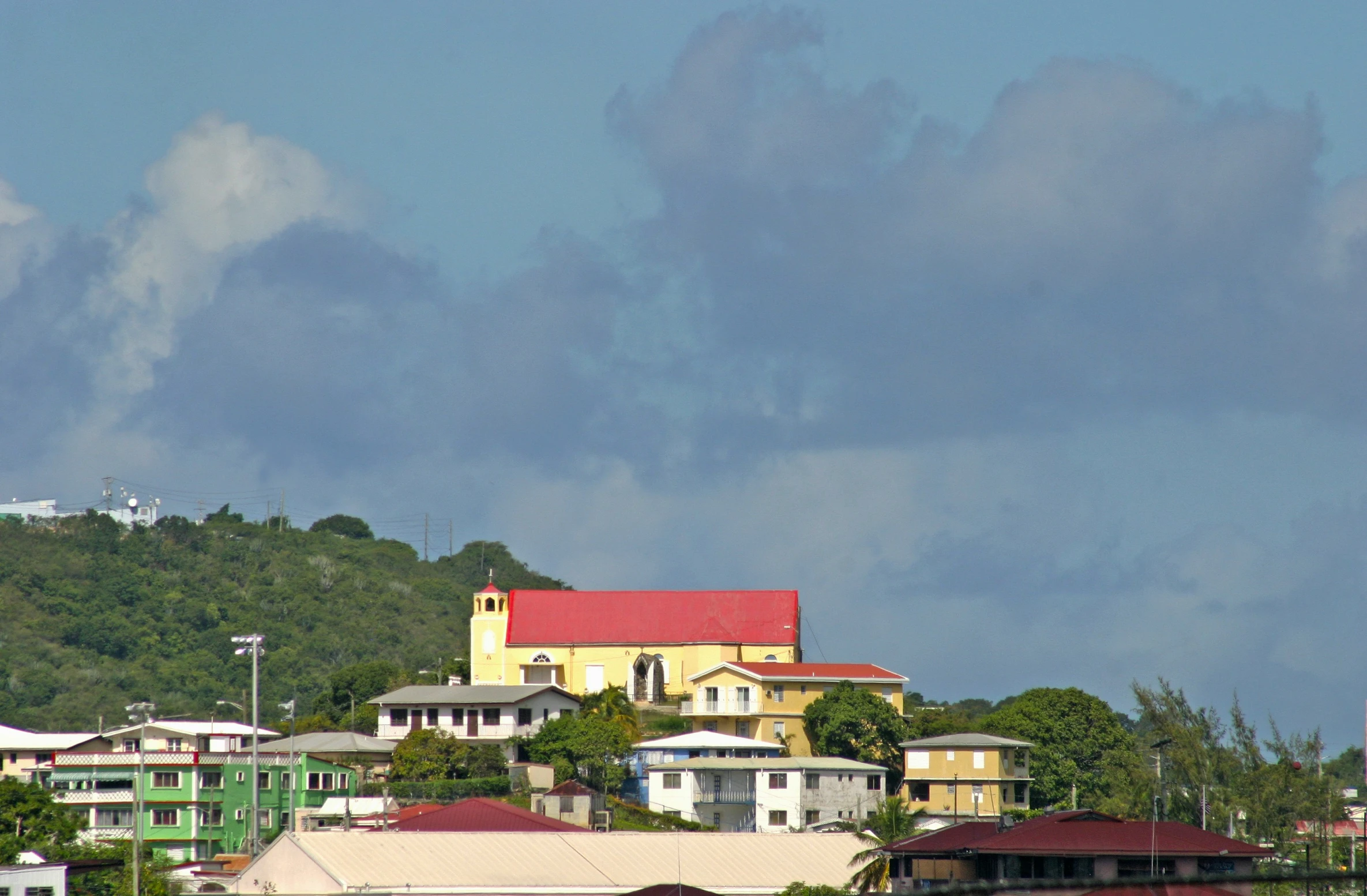 a house on the hills covered in clouds