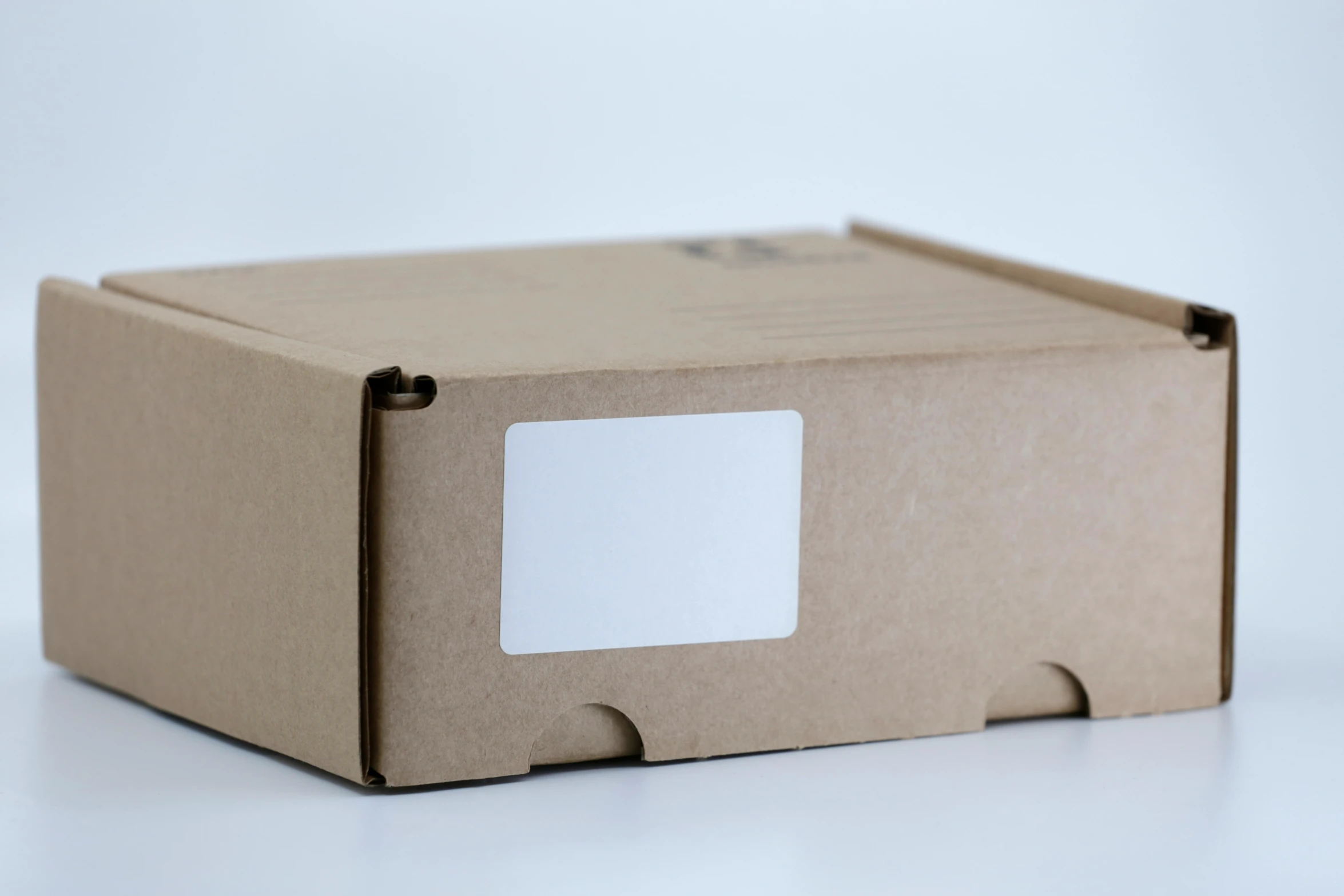 a closed cardboard box that is holding some cards