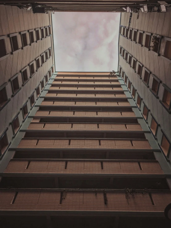 an image of a very tall building that looks out into the sky