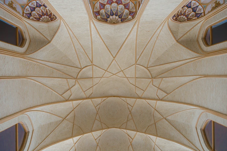 the ceiling inside the building is decorated in gold and red