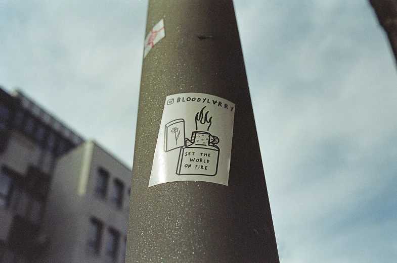 a sticker that is sitting on a pole