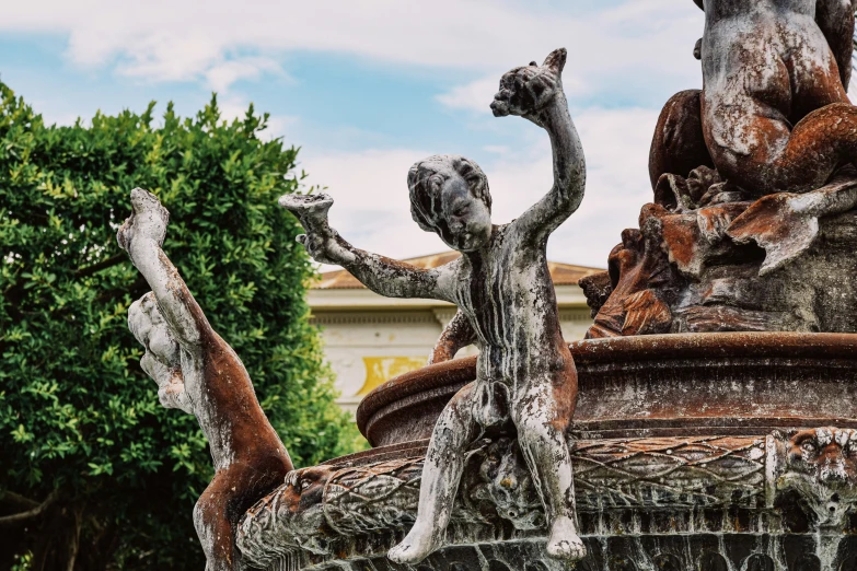 an old statue with many arms and hands