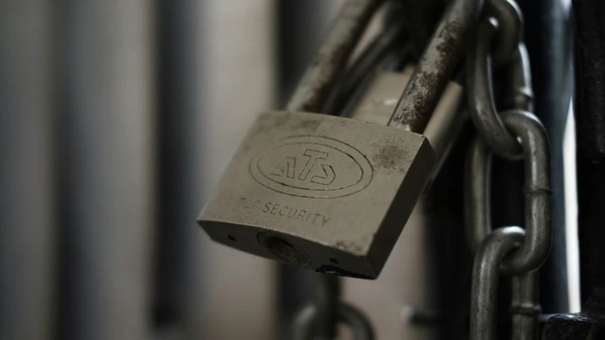 a combination padlock on a tall metal structure