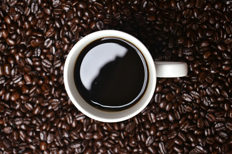 an overhead s of a coffee cup with its liquid on it