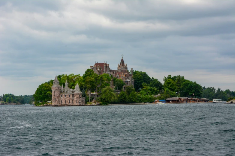 a very tall house sitting on top of a lake