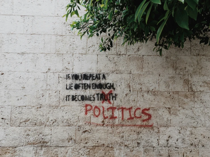 a brick wall with the word potts painted on it