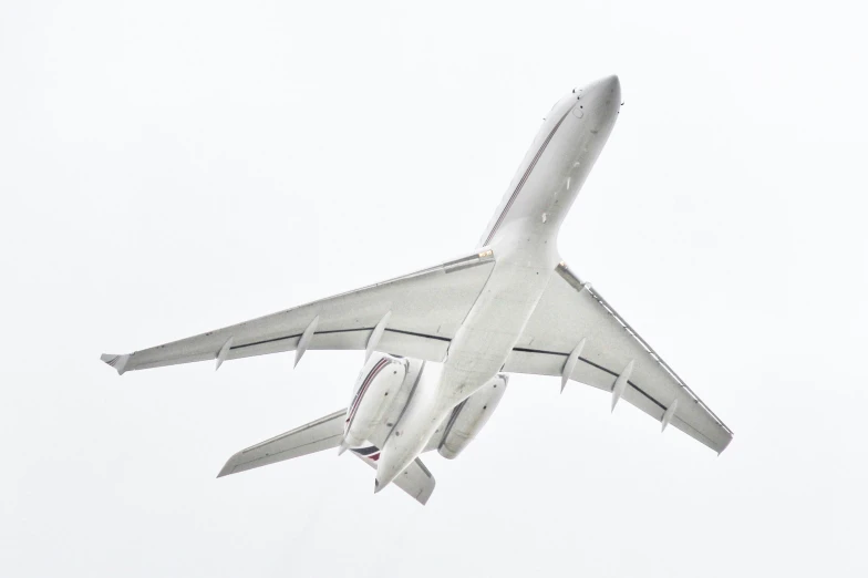 the underside of an airplane flying in the air