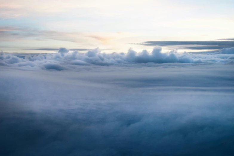 white clouds are seen above the blue sky