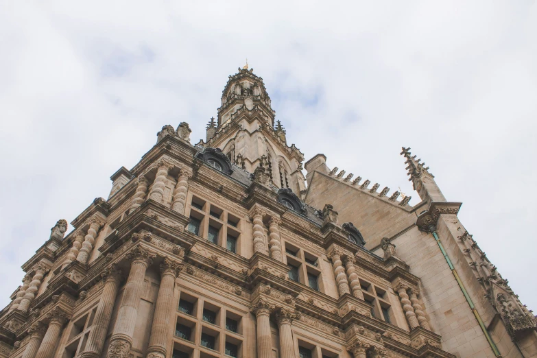 an old building with a tall tower and a clock