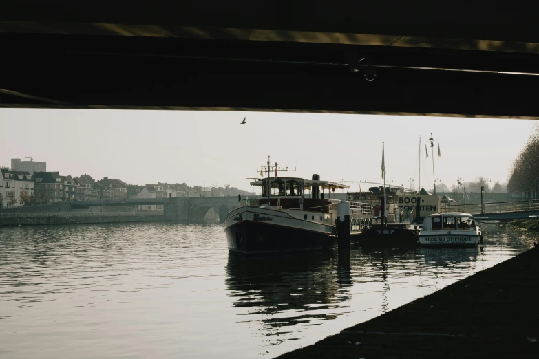 some boats are floating near the water together