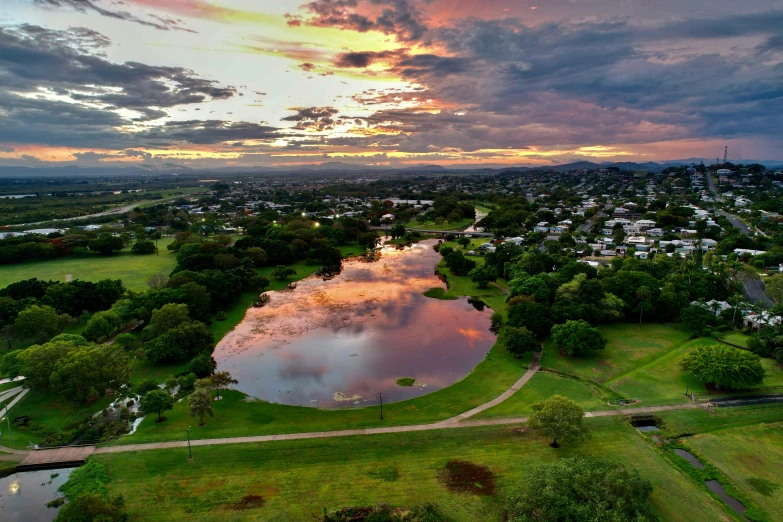 an aerial view of a lake surrounded by homes