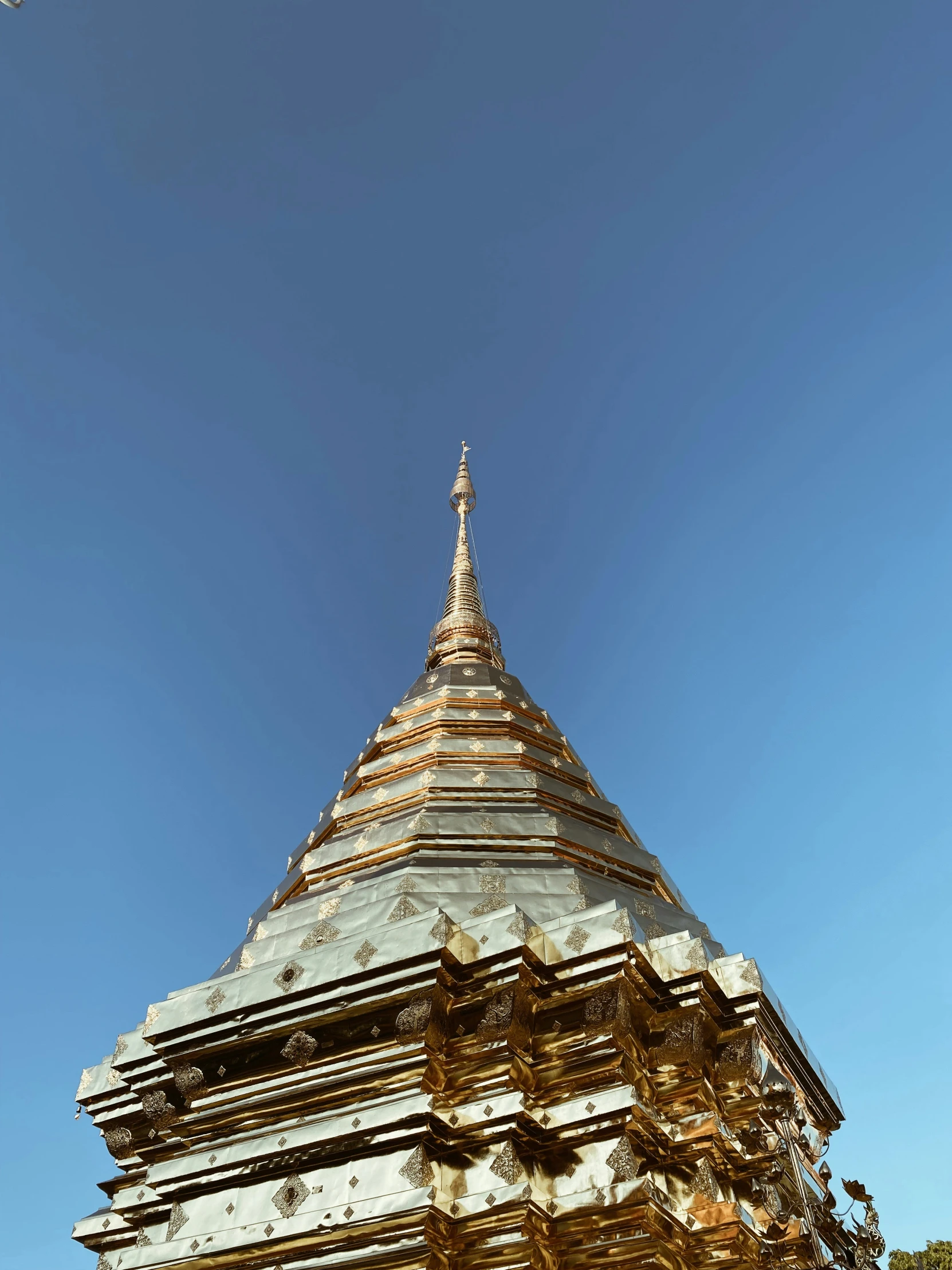 an upward view of a tall tower from below