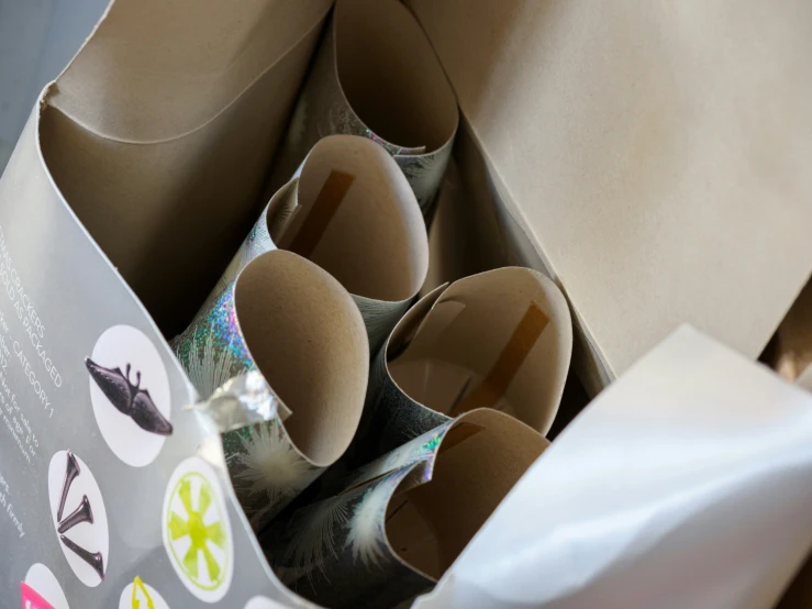 a box with five rolls of toilet paper inside