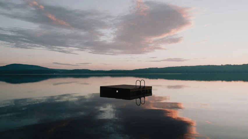 a building on the lake, just sitting in the water