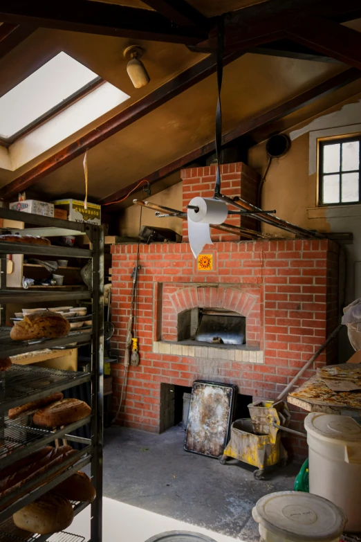 a brick oven built into a kitchen wall in a shop