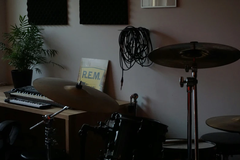 drums and two keyboards on a table next to a keyboard