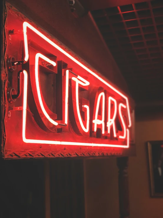 this neon sign is for a bar called digars