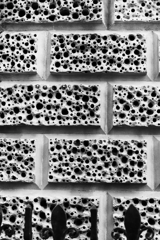 a black and white po of bubbles on a brick wall