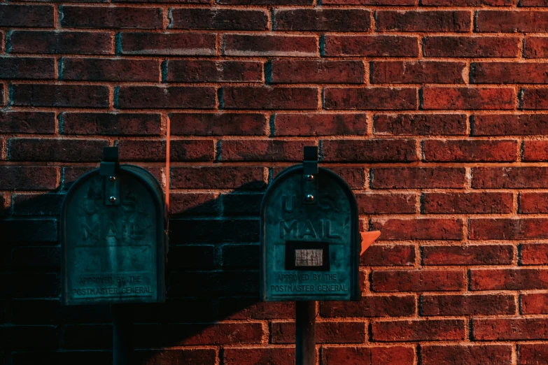 a couple of mail boxes on the side of a building