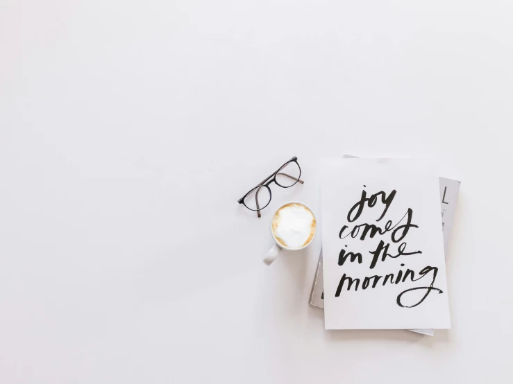 coffee cup on napkins and sunglasses with handwritten notes