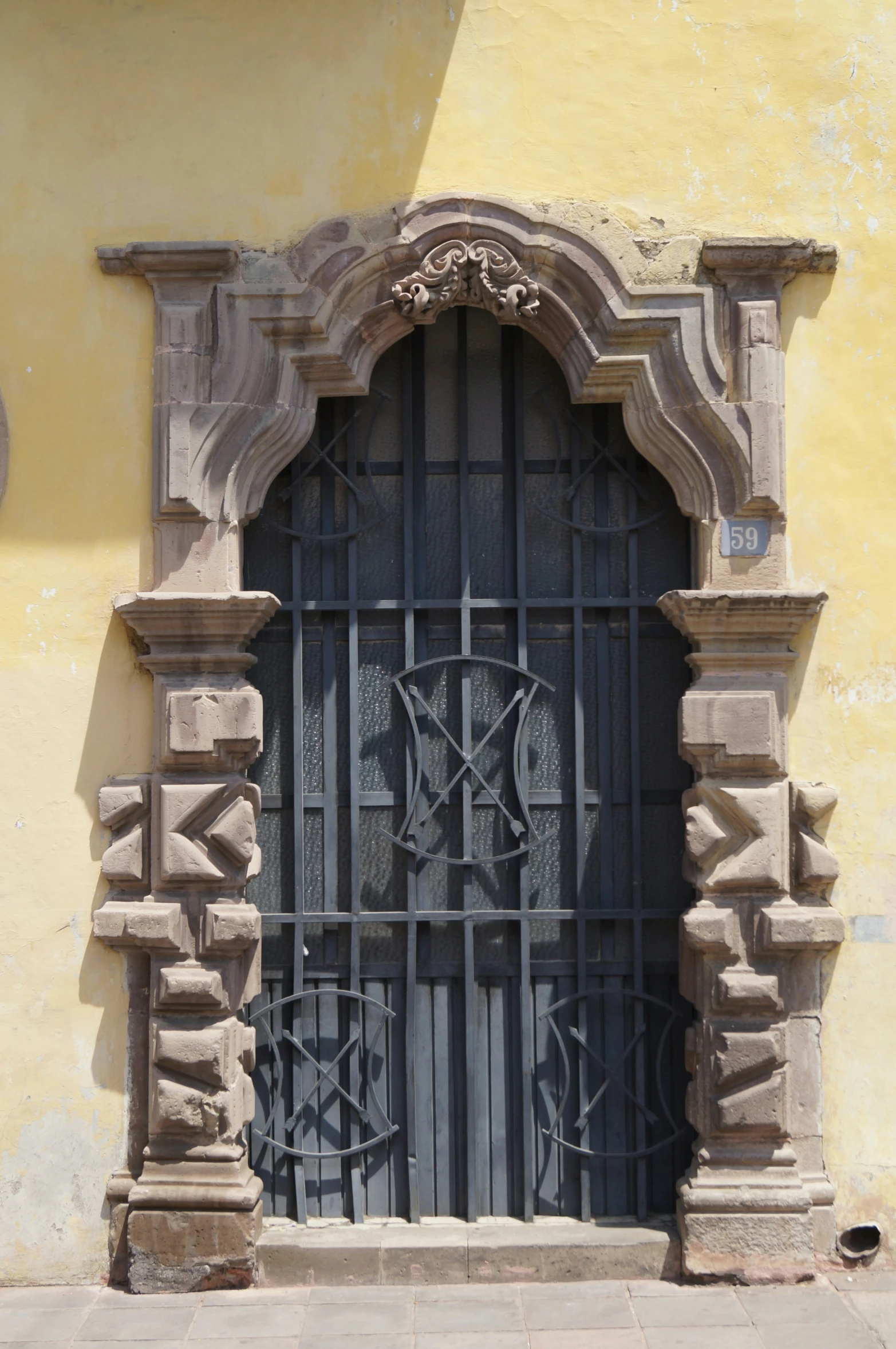 this is a close up view of the wrought iron doors