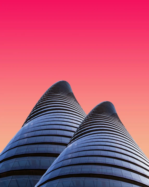 a tall building is in front of a pink and blue sky