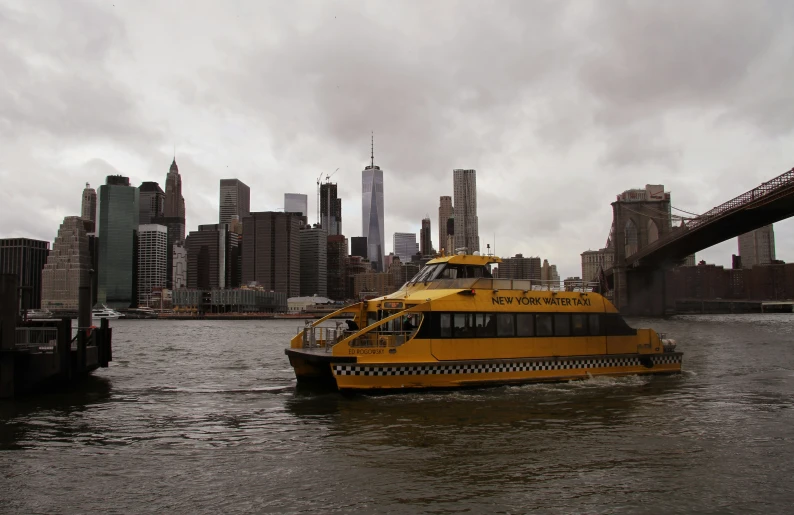 the ferry is in the water next to the city