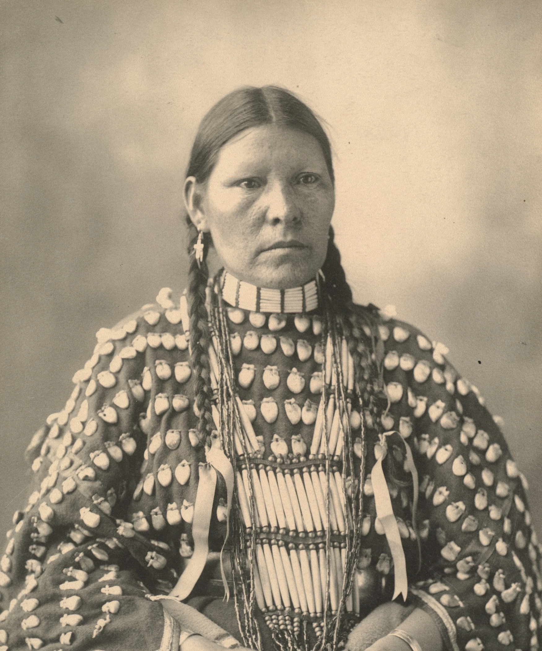 this native american woman is looking like she has no feathers