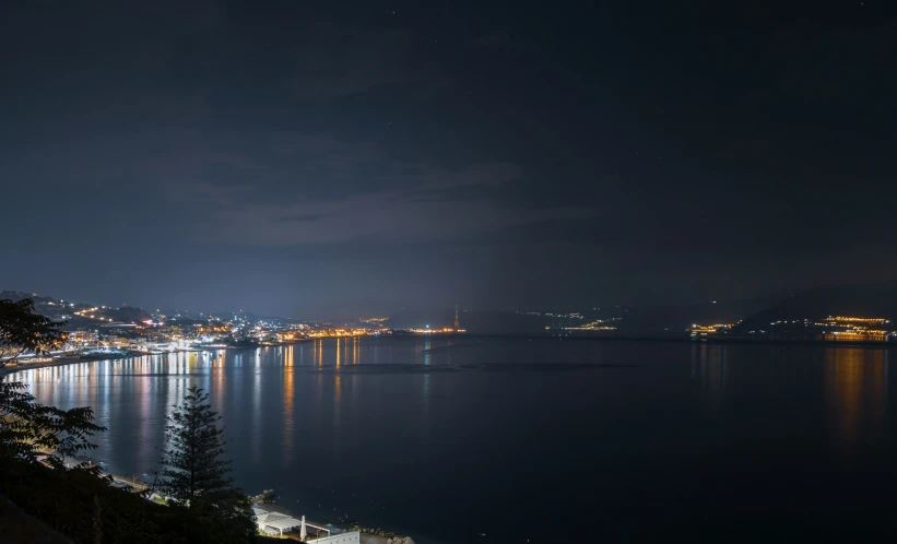 a town by the sea at night time