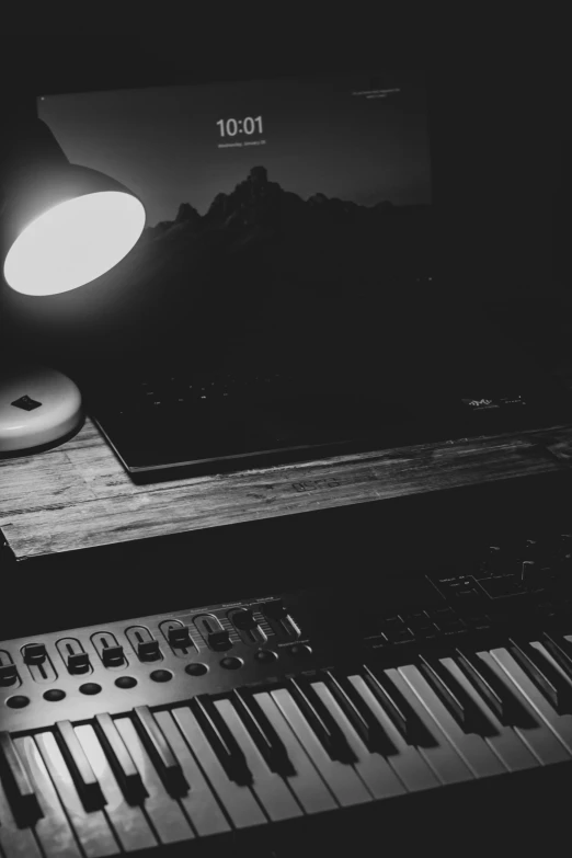 an old computer keyboard sitting in a black and white po