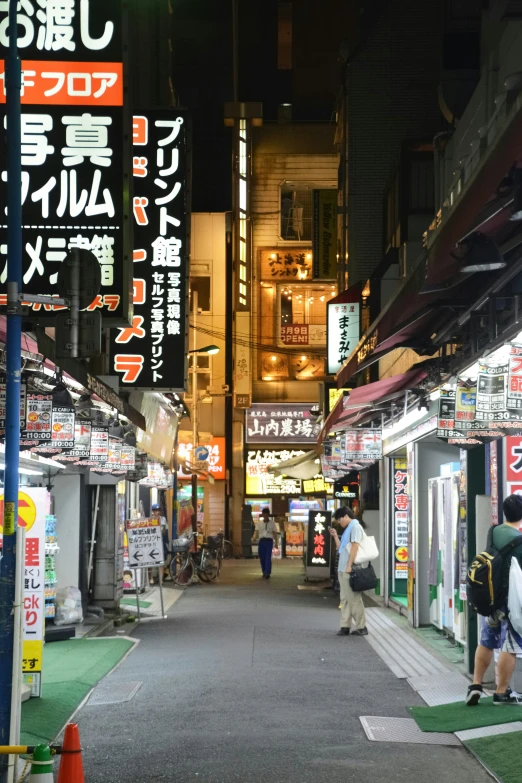 this is a street full of shops on either side of a road