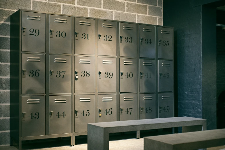 four mailboxes are shown behind a bench