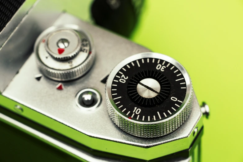 a metal mechanical device with green background