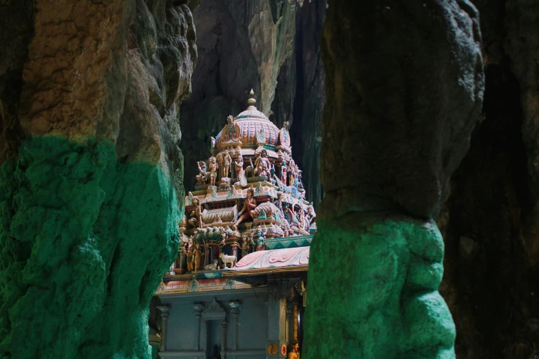 a small temple inside a cave with rock formations