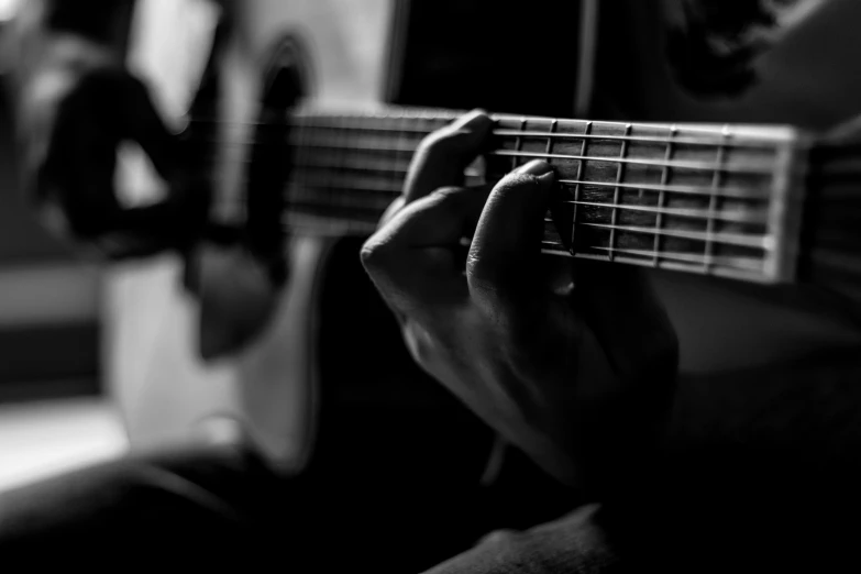 person holding a guitar up to their face