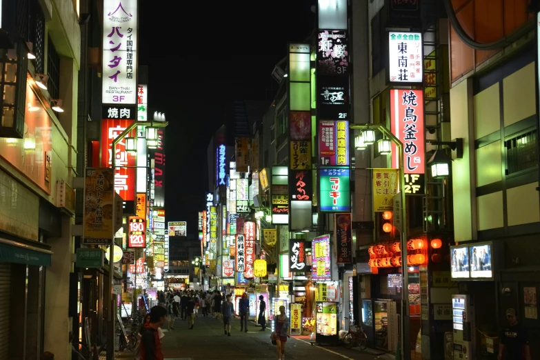 a narrow city street in a very busy area